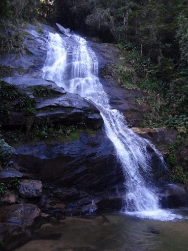 A beautiful waterfall in the Brazilian jungle close to the city in Rio on the way to the Cristo Redentor