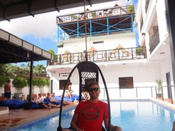 Grant by the pool at the Mad Monkey Hostel