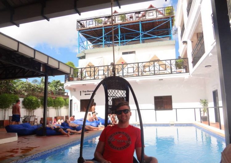 Grant by the pool at the Mad Monkey Hostel