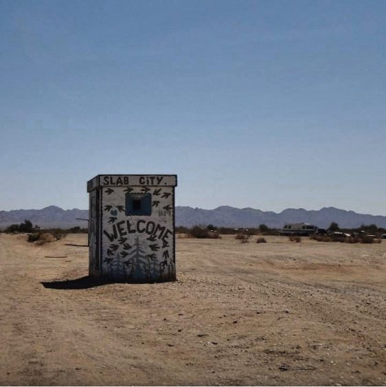 A Welcome to Slab City sign 