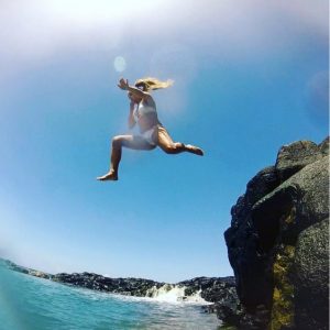 Rachel jumping in at Queen's Bath Kauai
