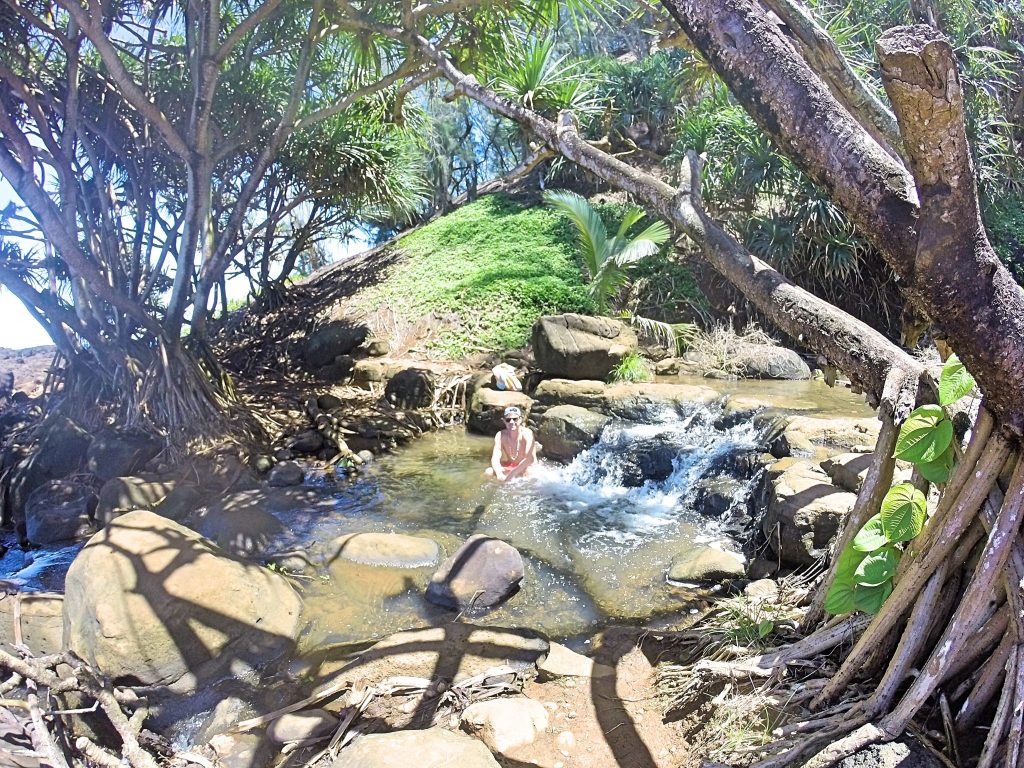 Grant in waterfall at Queen's Bath Kauai