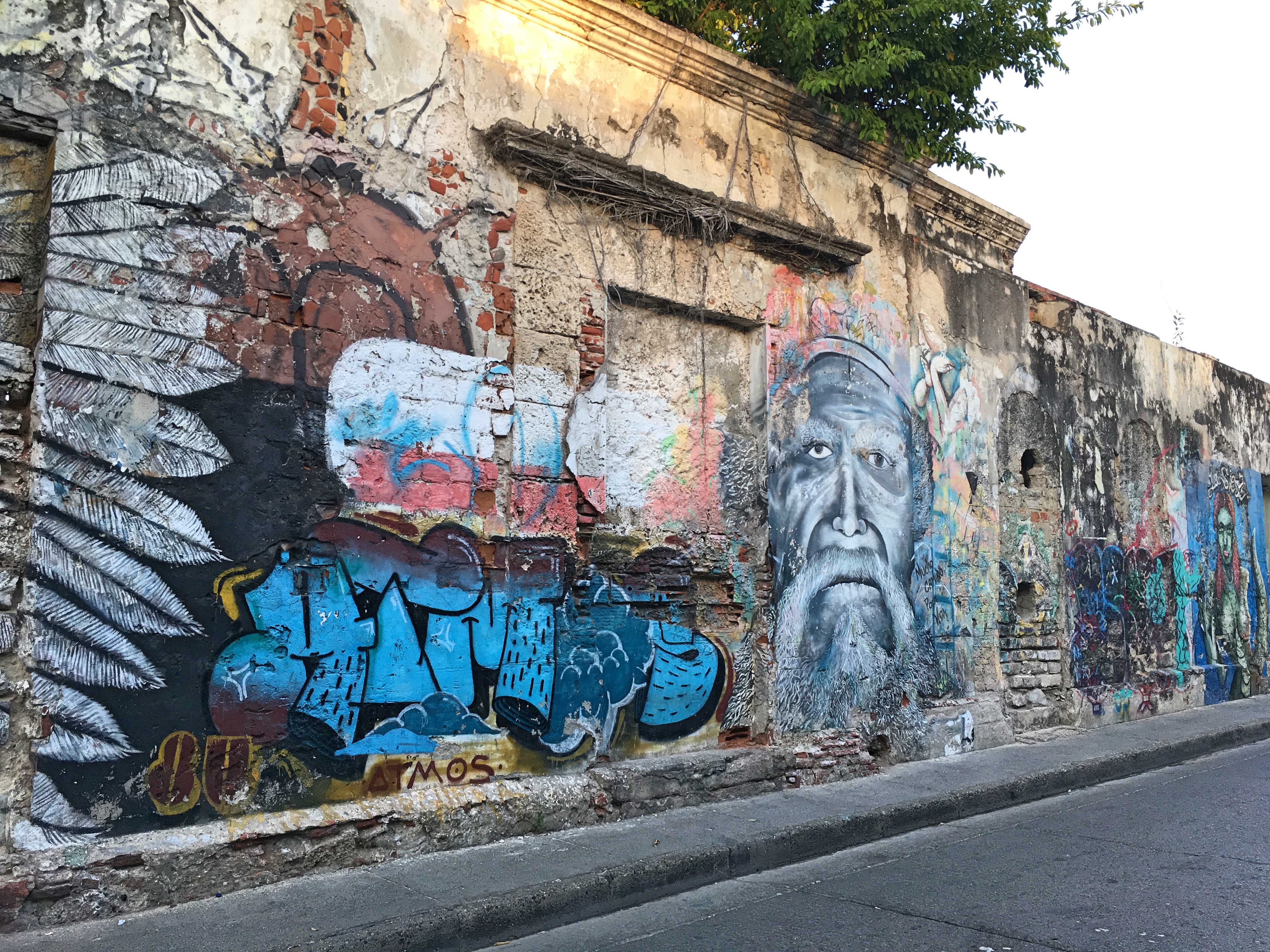 man's face street art in Cartagena