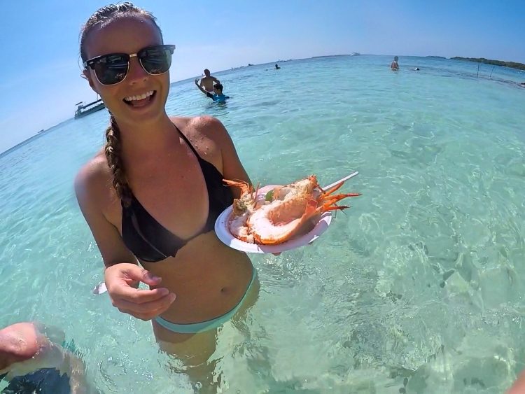 eating lobster in ocean on isla grande